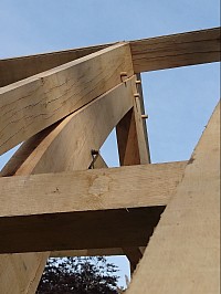 Top cruck frame on hammer beam.